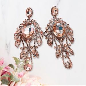 Crown winning rose gold earrings
